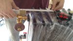 Beautiful brass and wood thermostatic tap in place.
The radiators are still wrapped in foil to protect them.