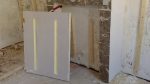 Space for the wood (the radiator, which is very heavy,
will be screwed to it) carved out of the insulation.