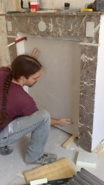 Fitting into the mantel. We also put an horizontal
piece on the top, since the marble was bare there.