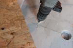 One 5 cm hole for the drain, two 1 cm holes for cold and warm water.