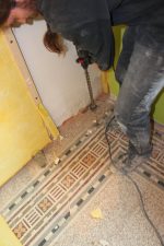 Drilling holes for pipes and cables into the basement.
